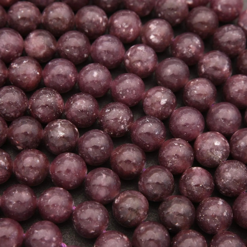 Close-up of purple beads on a dark background