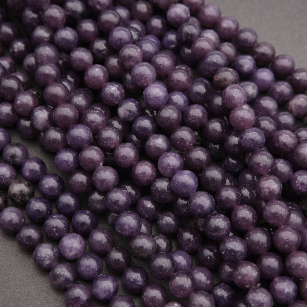 Close-up of purple beads on a dark background