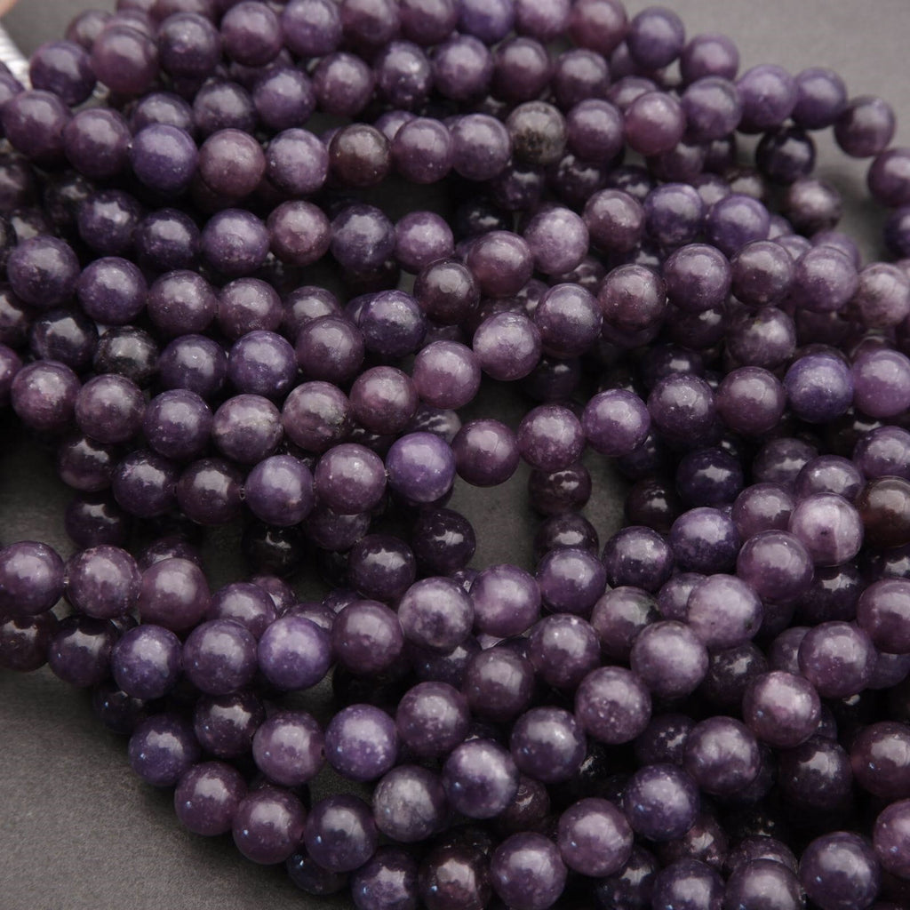 Close-up of purple beads on a dark background