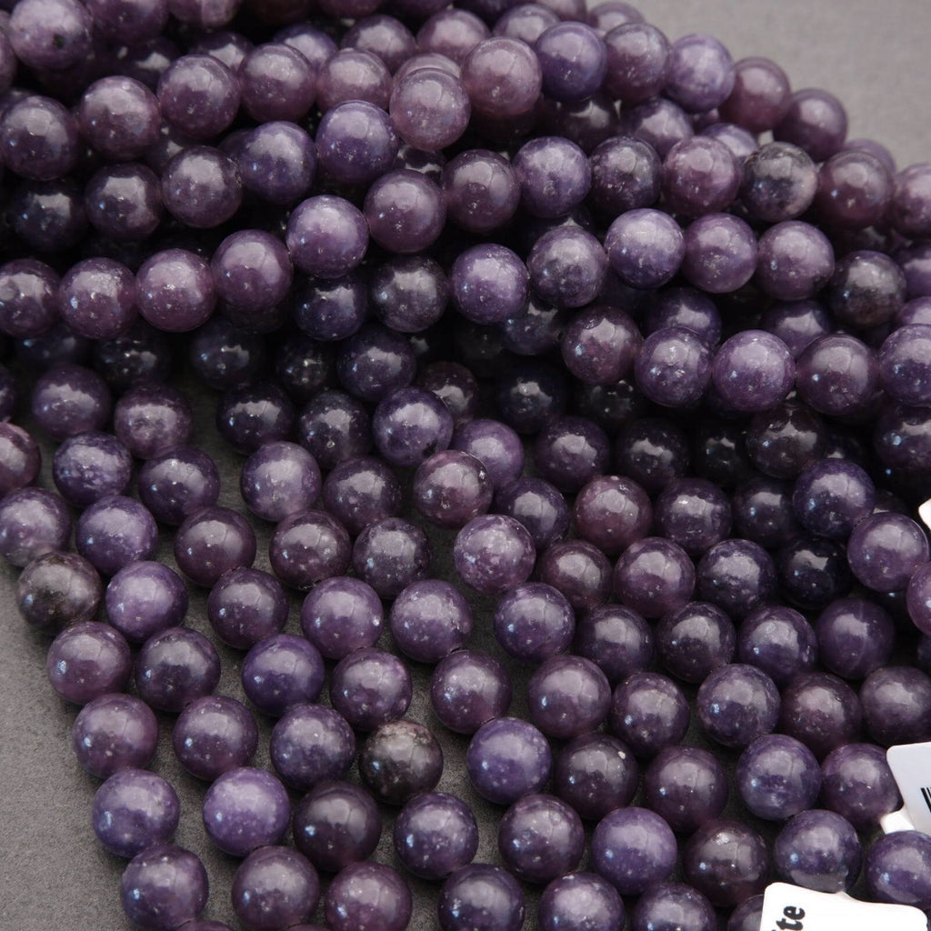 Close-up of purple beads on a gray surface