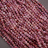 Purple and pink round faceted beads.
