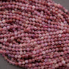 Purple and pink round faceted beads.