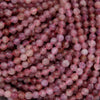 Purple and pink round faceted beads.