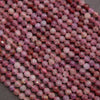 Purple and pink round faceted beads.