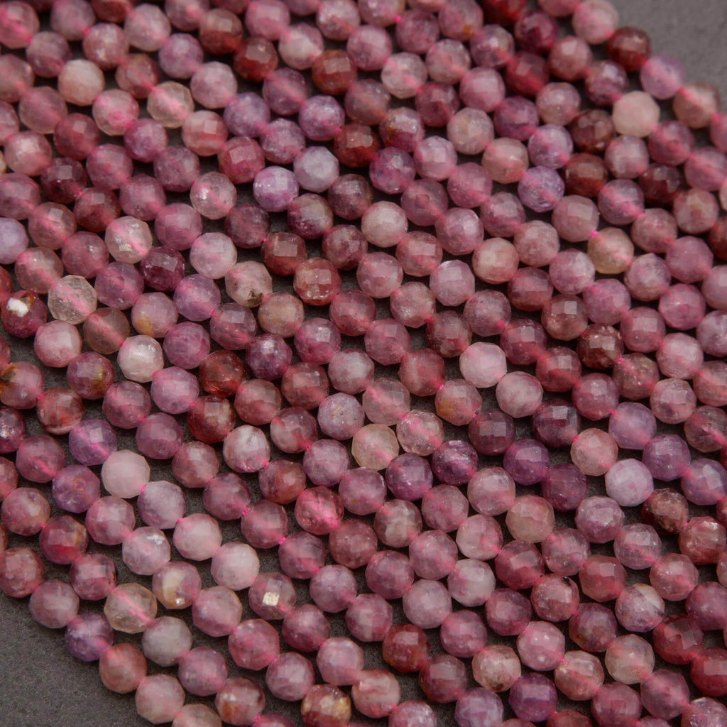 Purple and pink round faceted beads.