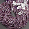 Faceted lepidolite beads in shades of lilac and plum with organic color variations