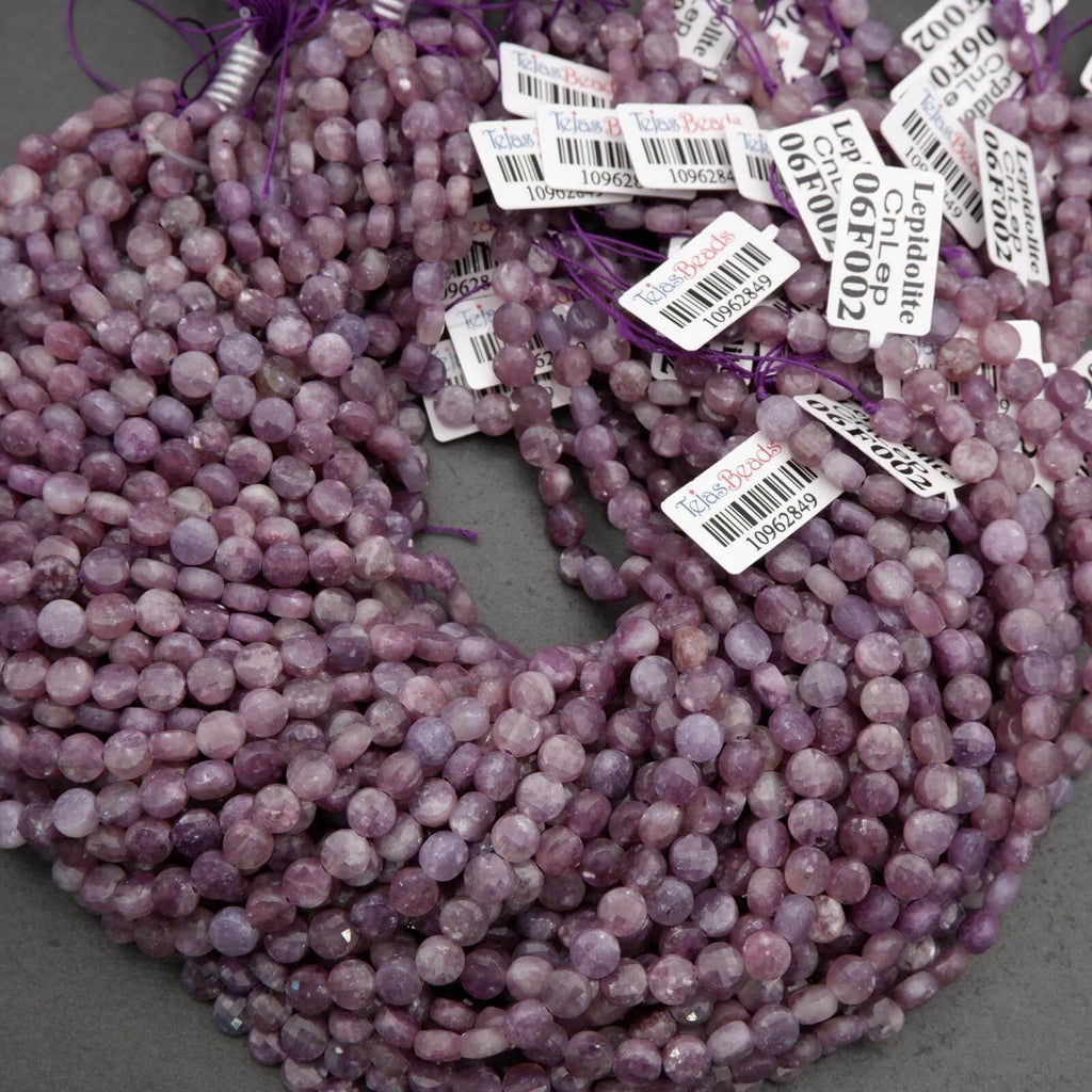 Faceted lepidolite beads in shades of lilac and plum with organic color variations