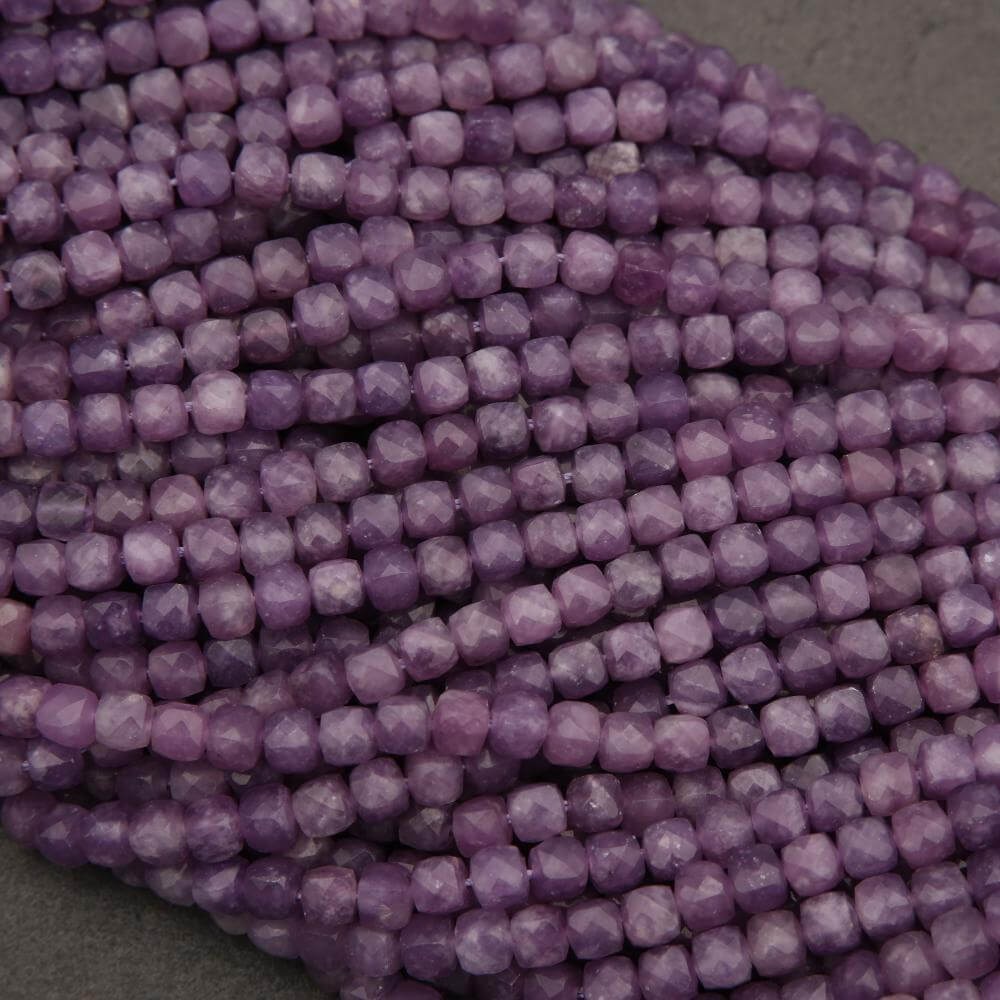 Close-up of purple beads on a dark background