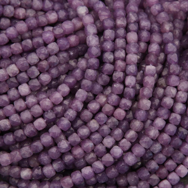 Close-up of purple beads arranged in a pattern