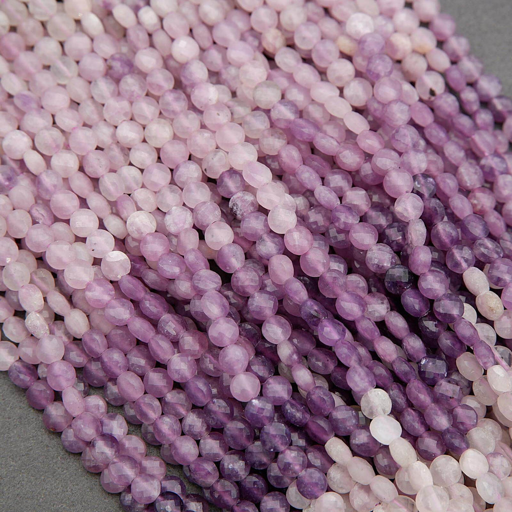 Close-up of purple and pink beads on a gray background