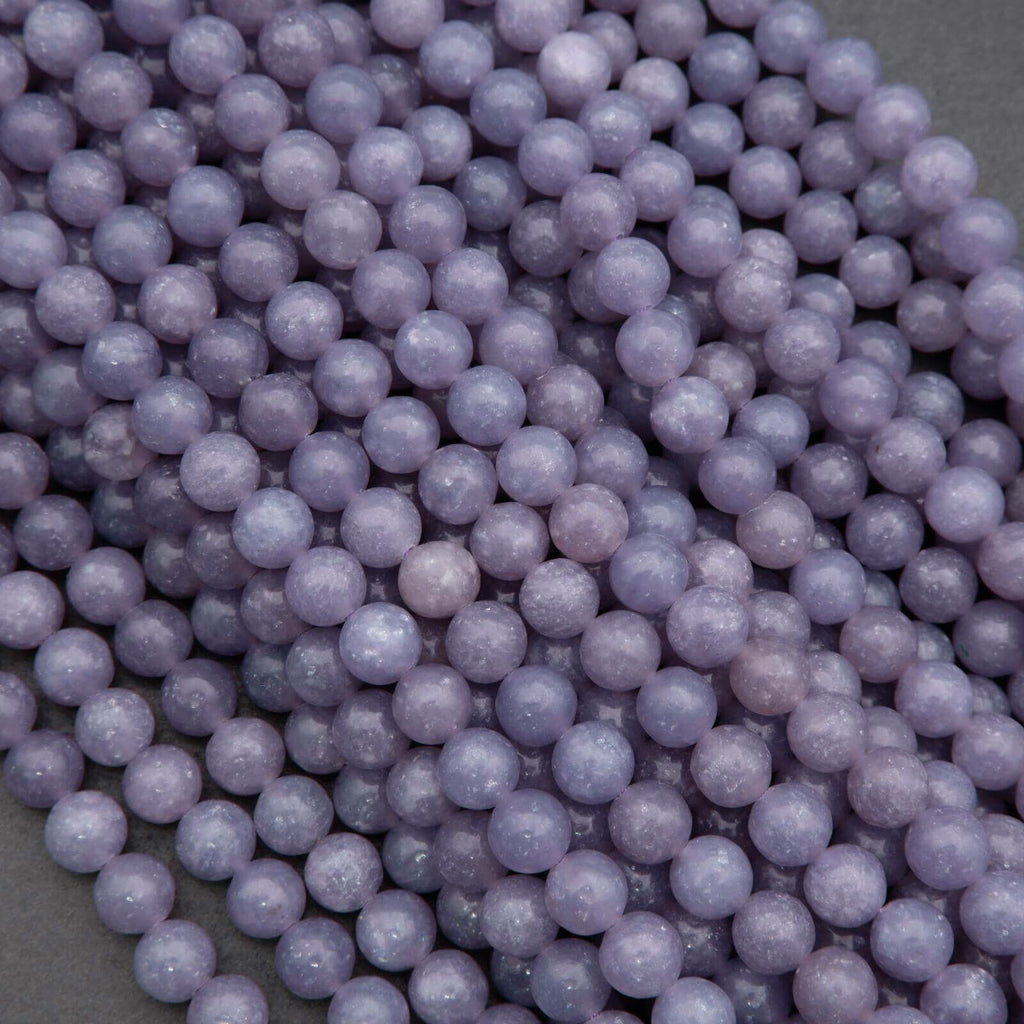 Close-up of purple beads on a gray background