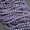 Close-up of purple beads on a gray background