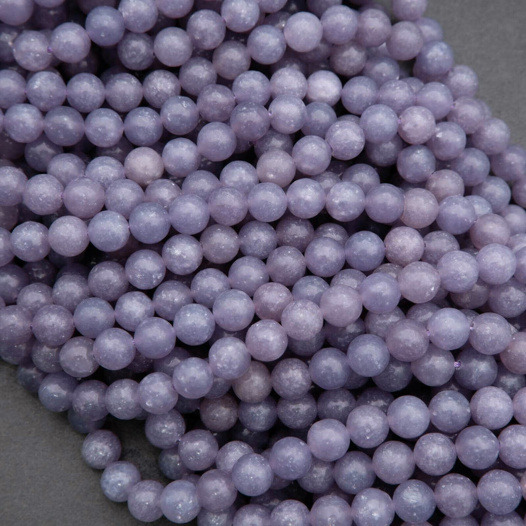 Close-up of purple beads on a gray background