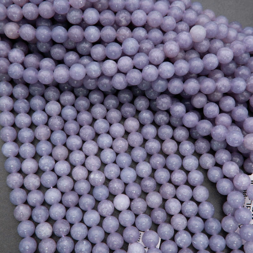 Close-up of purple beads on a gray background