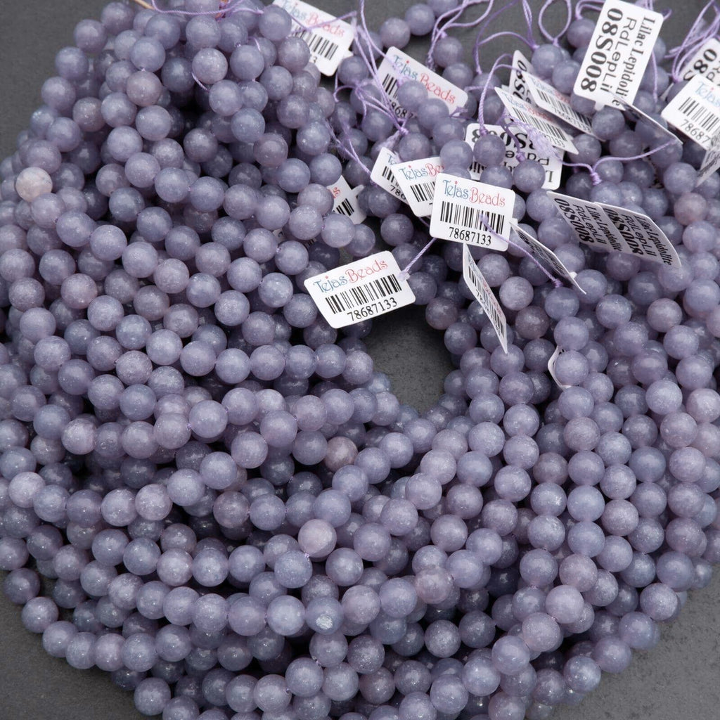 Purple beads with price tags on a gray background