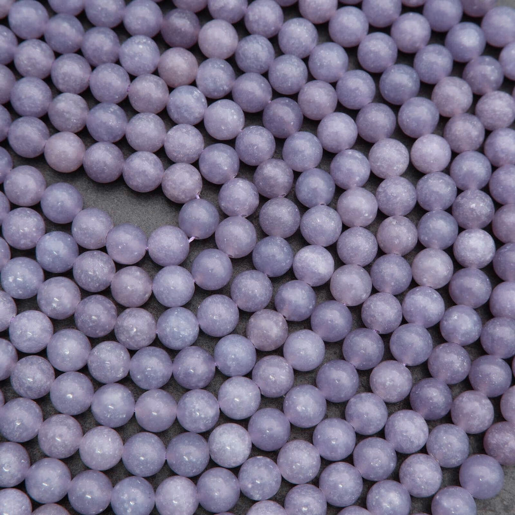 Close-up of purple beads on a dark background