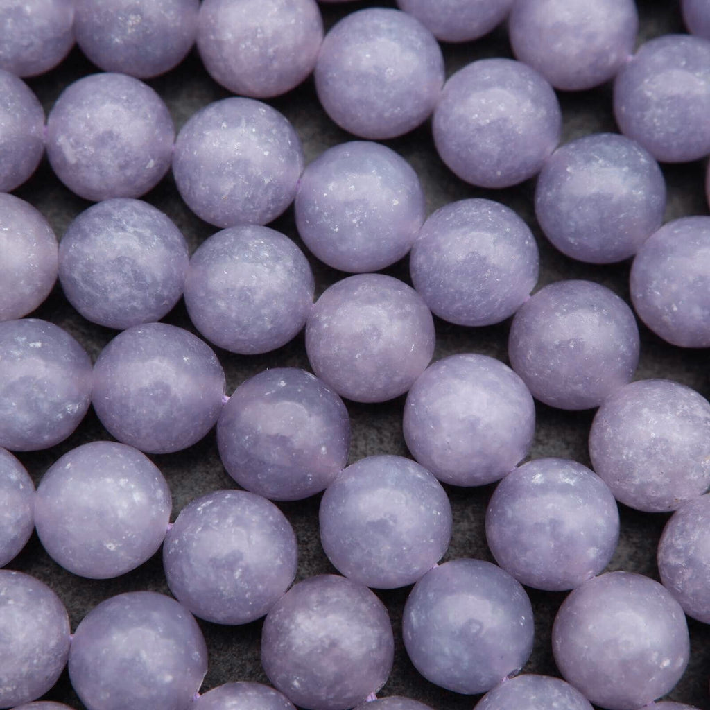 Close-up of purple beads on a dark background