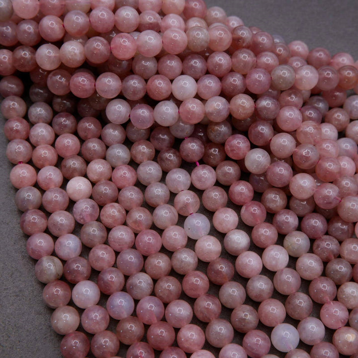 Close-up of pink beads on a gray surface