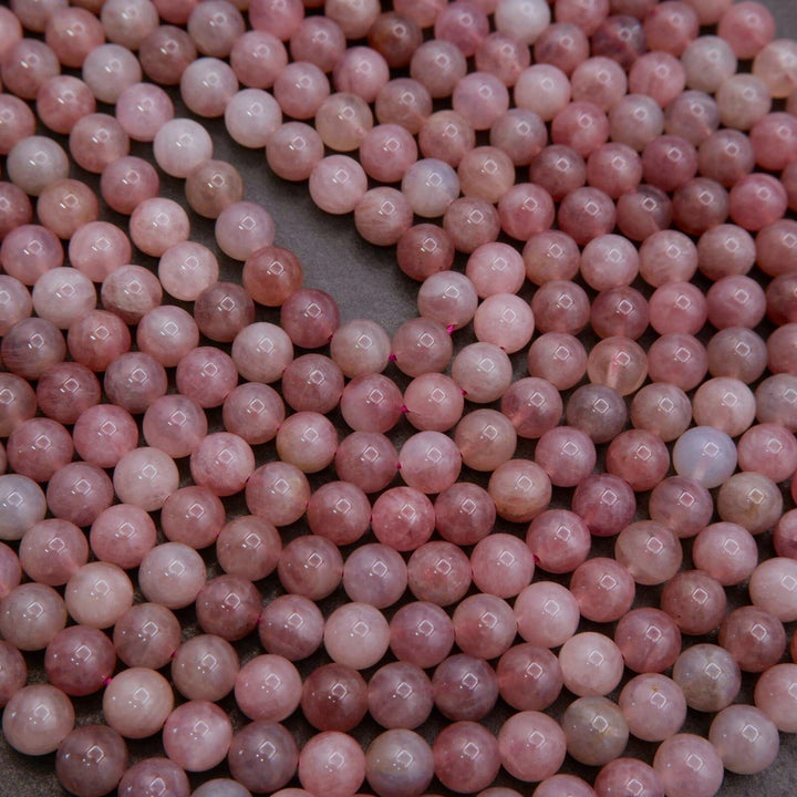 Close-up of pink pearls on a gray surface