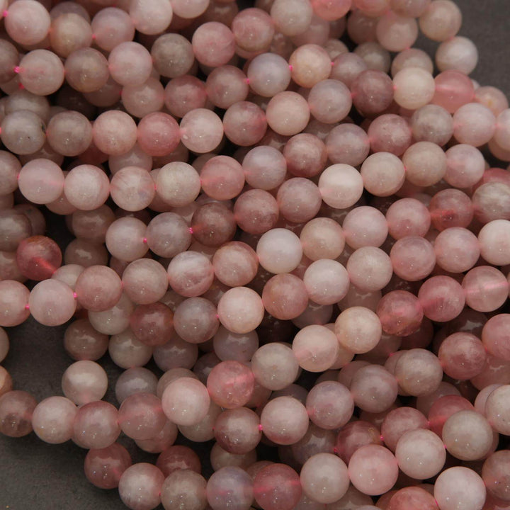 Close-up of pink beads on a dark background