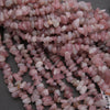 Close-up of pink pebbles on a gray background