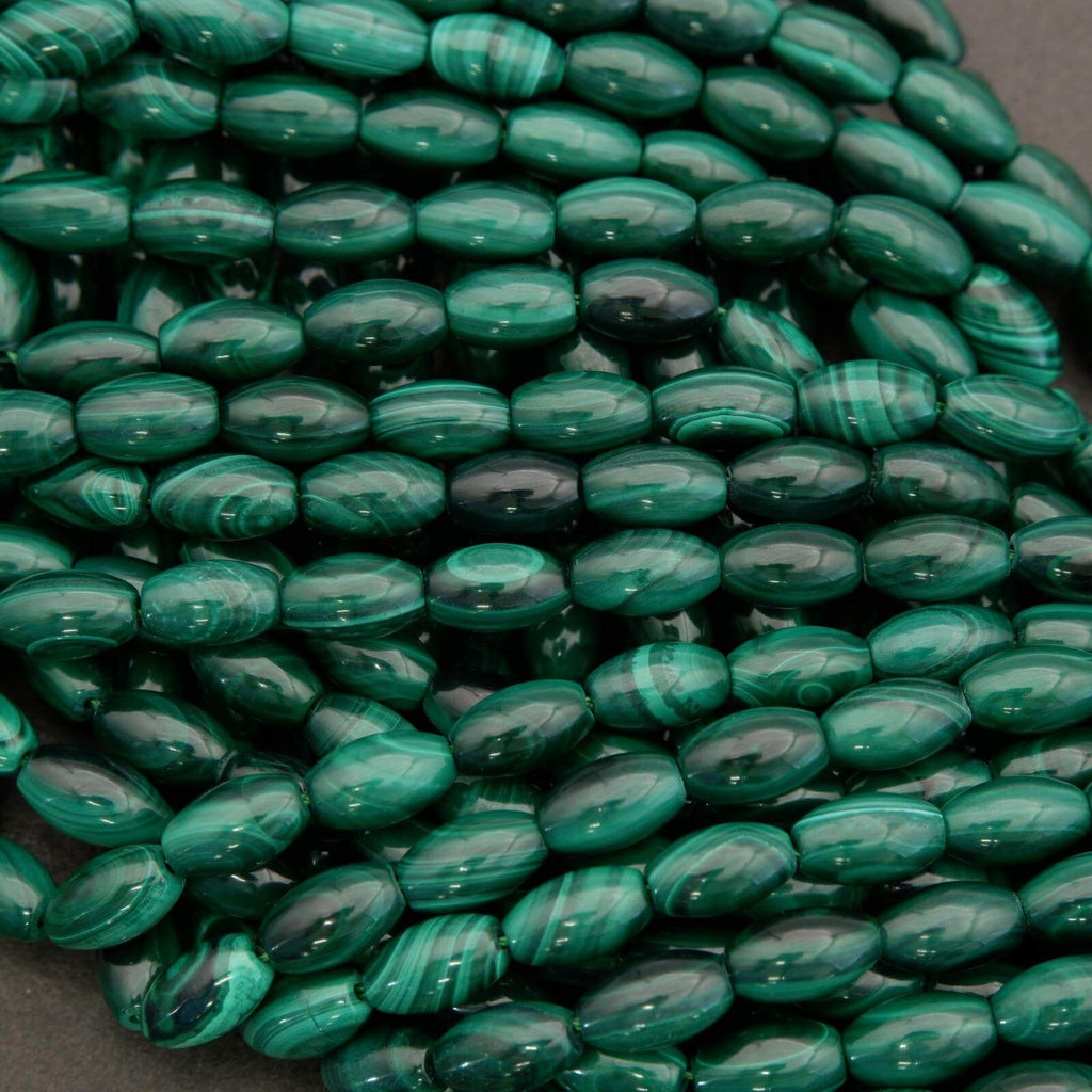 Close-up of green beads on a dark background