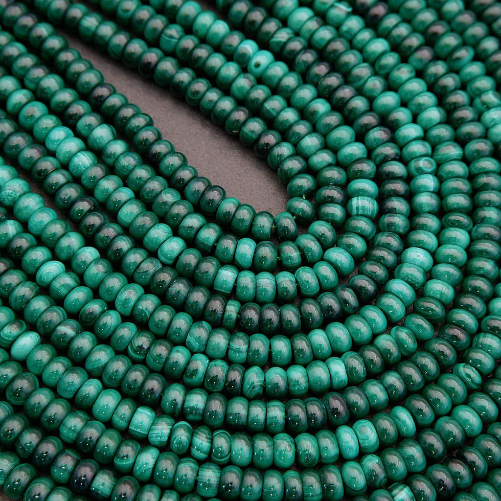 Close-up of green beads on a dark background