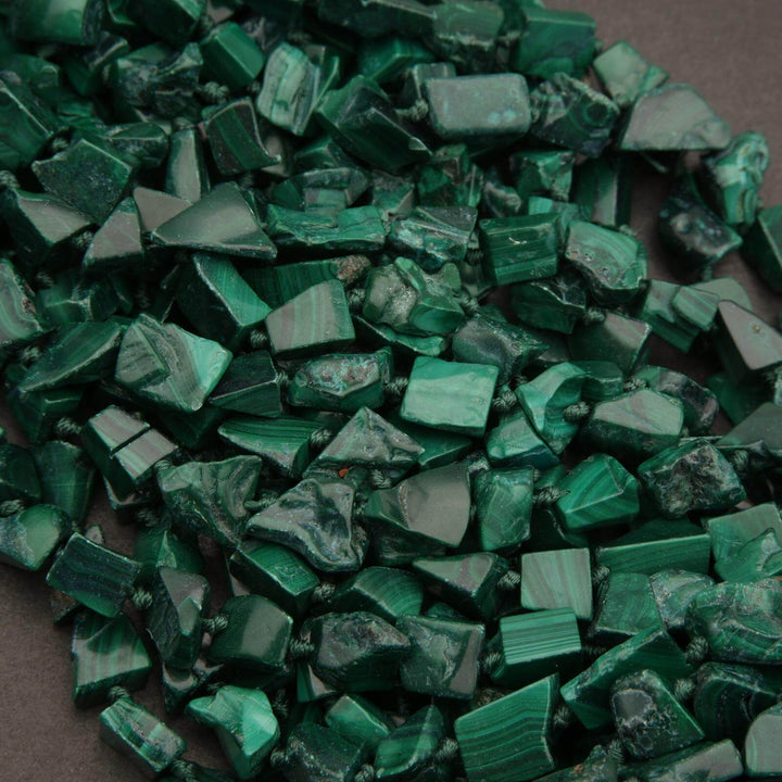 Close-up of green stone chips on a dark background