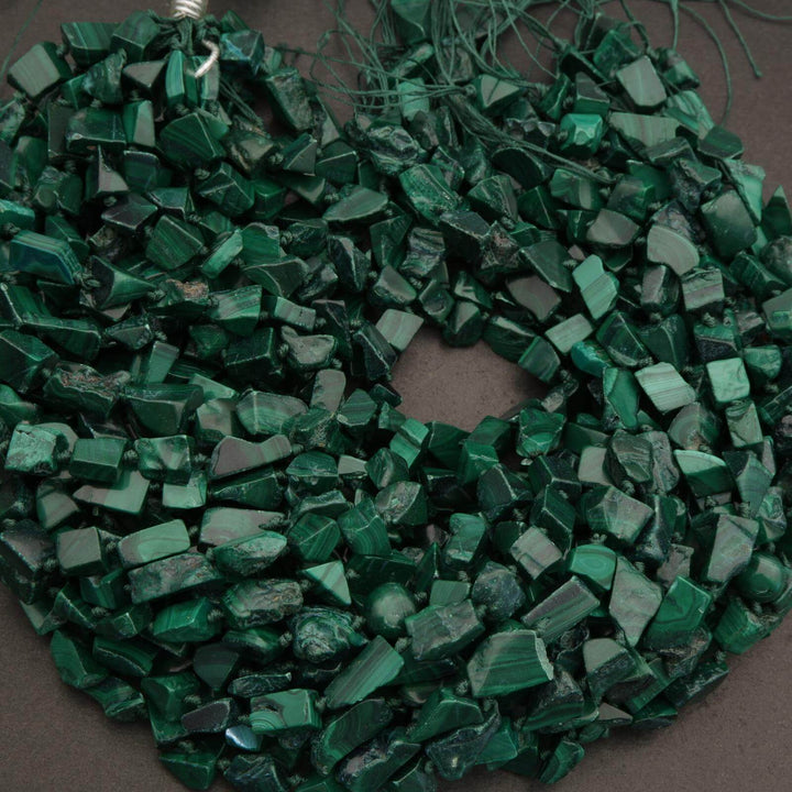 Green pebbles on a dark background