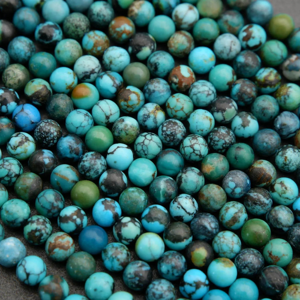 Close-up of turquoise beads with brown and green speckles