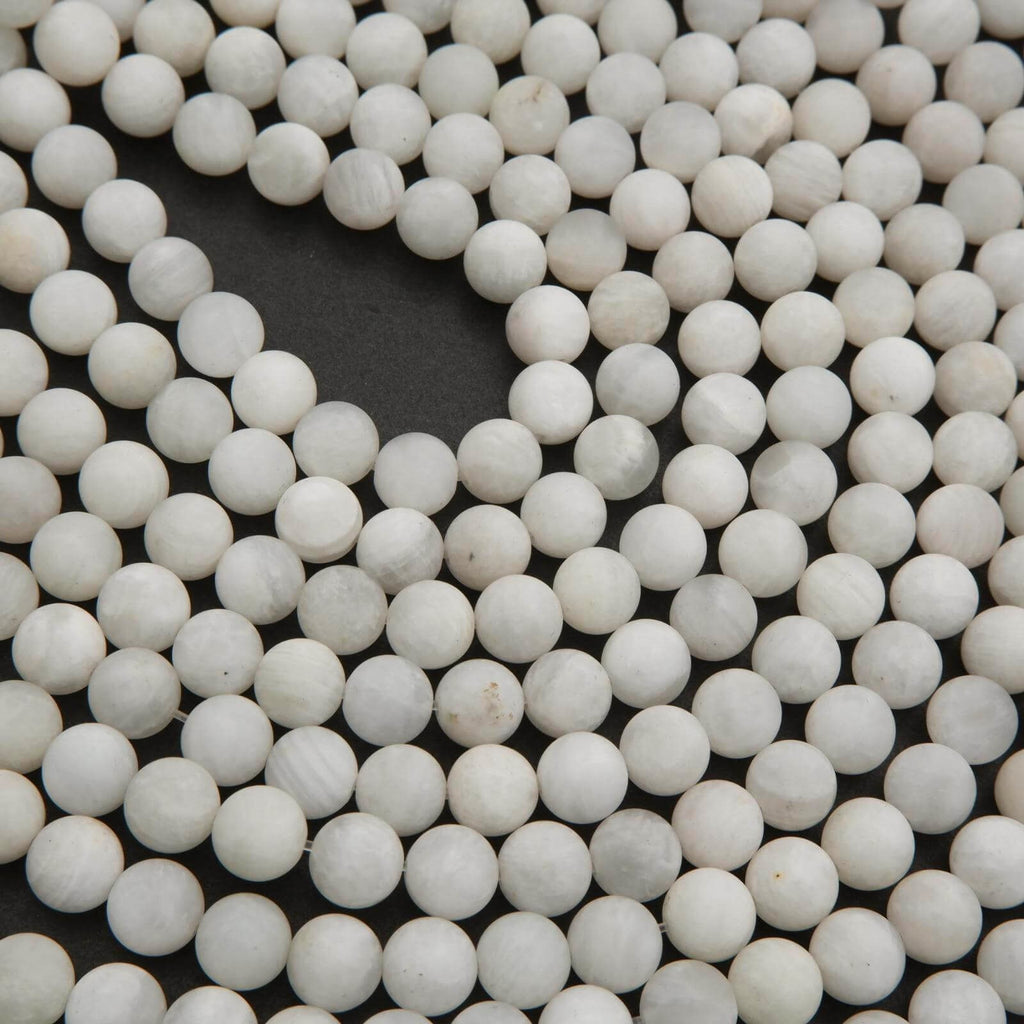 Close-up of white spherical beads on a black background