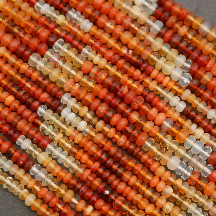 Close-up of multicolored bead strands on a gray background