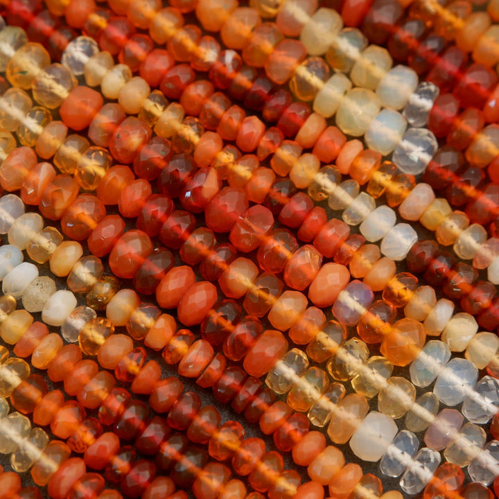 Close-up of multicolored beads on a textured surface