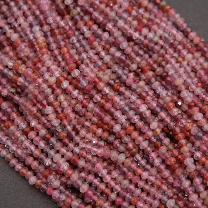 Close-up of pink and red beads on a dark background