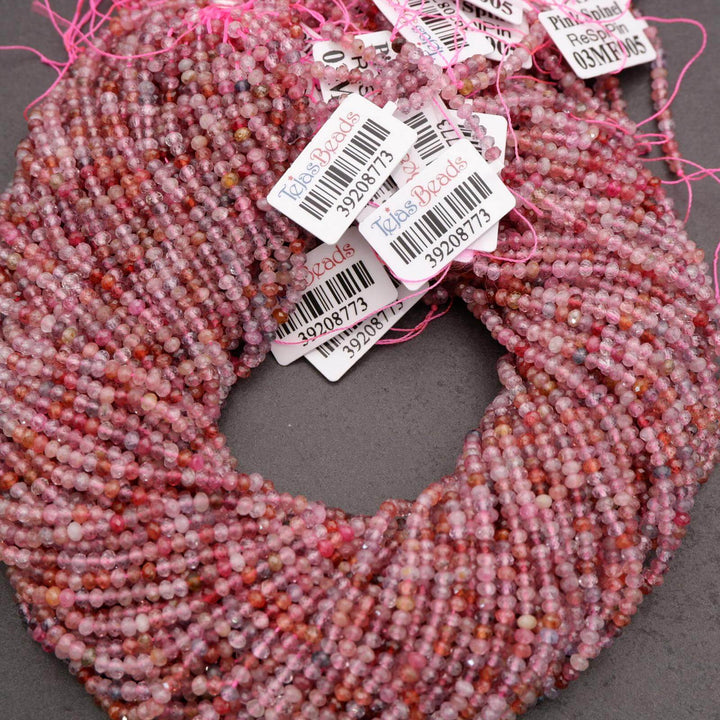 Pink beaded scarf with barcodes and product tags on a dark background