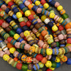 Colorful assortment of beads on a dark surface