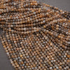Close-up of a string of multicolored beads on a gray background