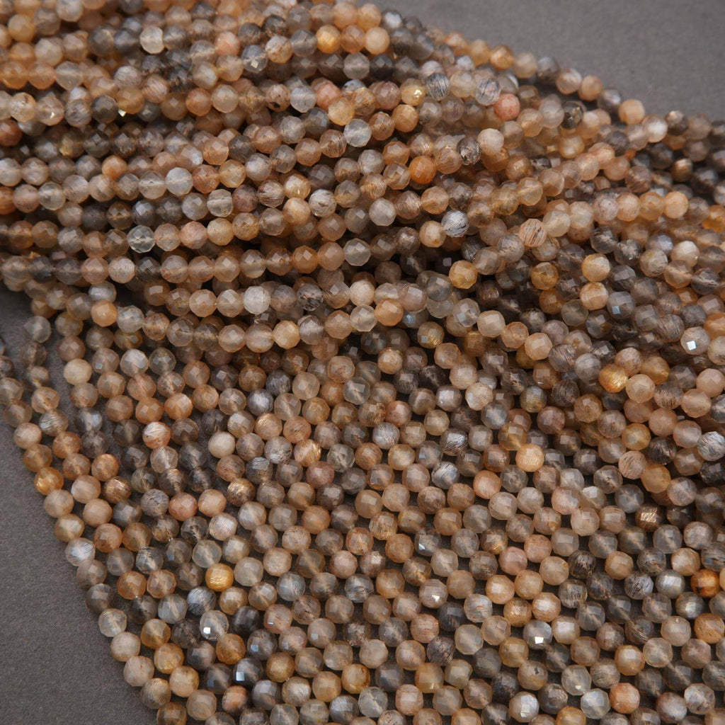 Close-up of a string of multicolored beads on a gray background