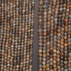Close-up of two strands of brown and gray beads on a dark background