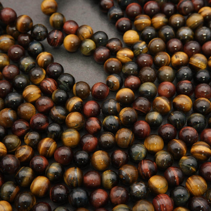 Close-up of multicolored tiger eye beads on a dark background