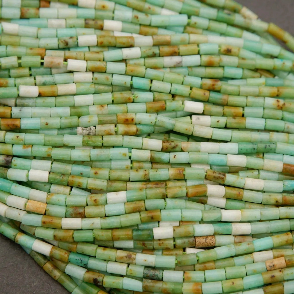 Close-up of a string of green and white beads.