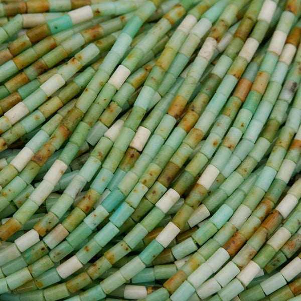 Close-up of green and brown cylindrical beads.