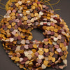 String of multicolored heart-shaped beads on a dark background
