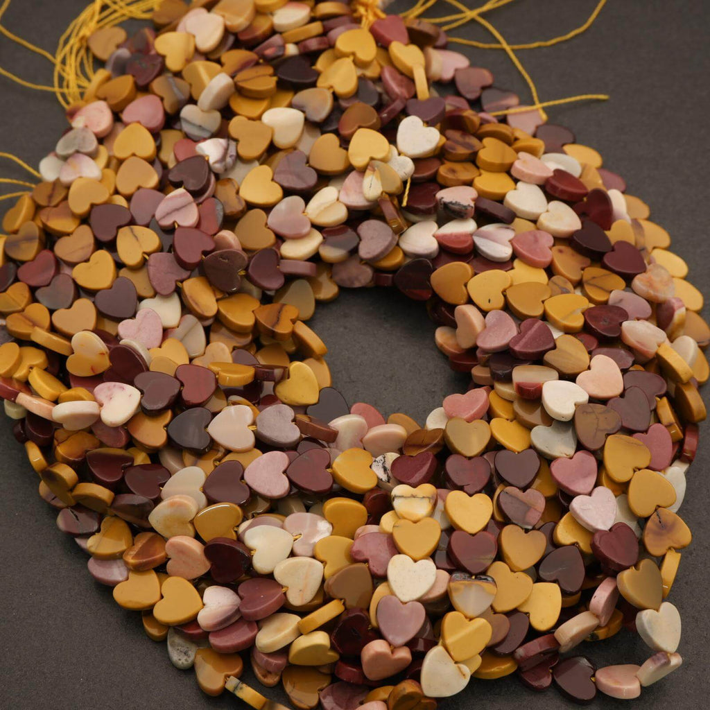 String of multicolored heart-shaped beads on a dark background
