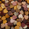 Close-up of heart-shaped candies in various colors.