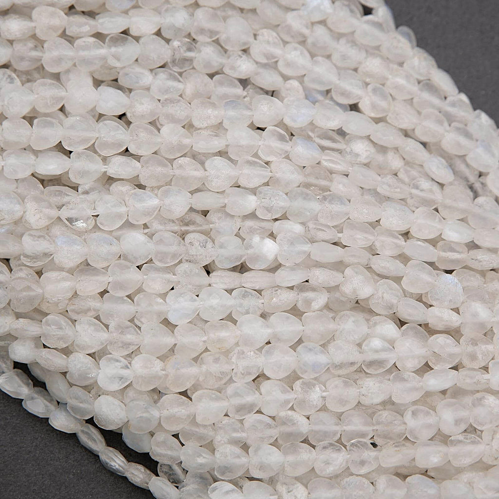 Close-up of a string of small, clear beads on a dark background