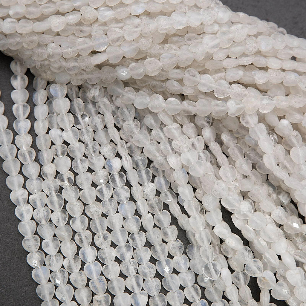 Close-up of white beaded strands on a dark background