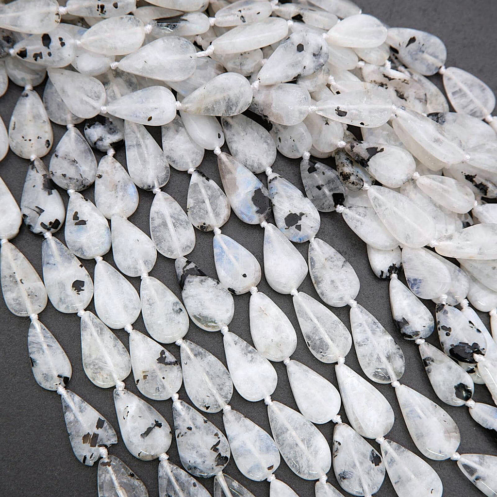 Teardrop-shaped beads with a gray background