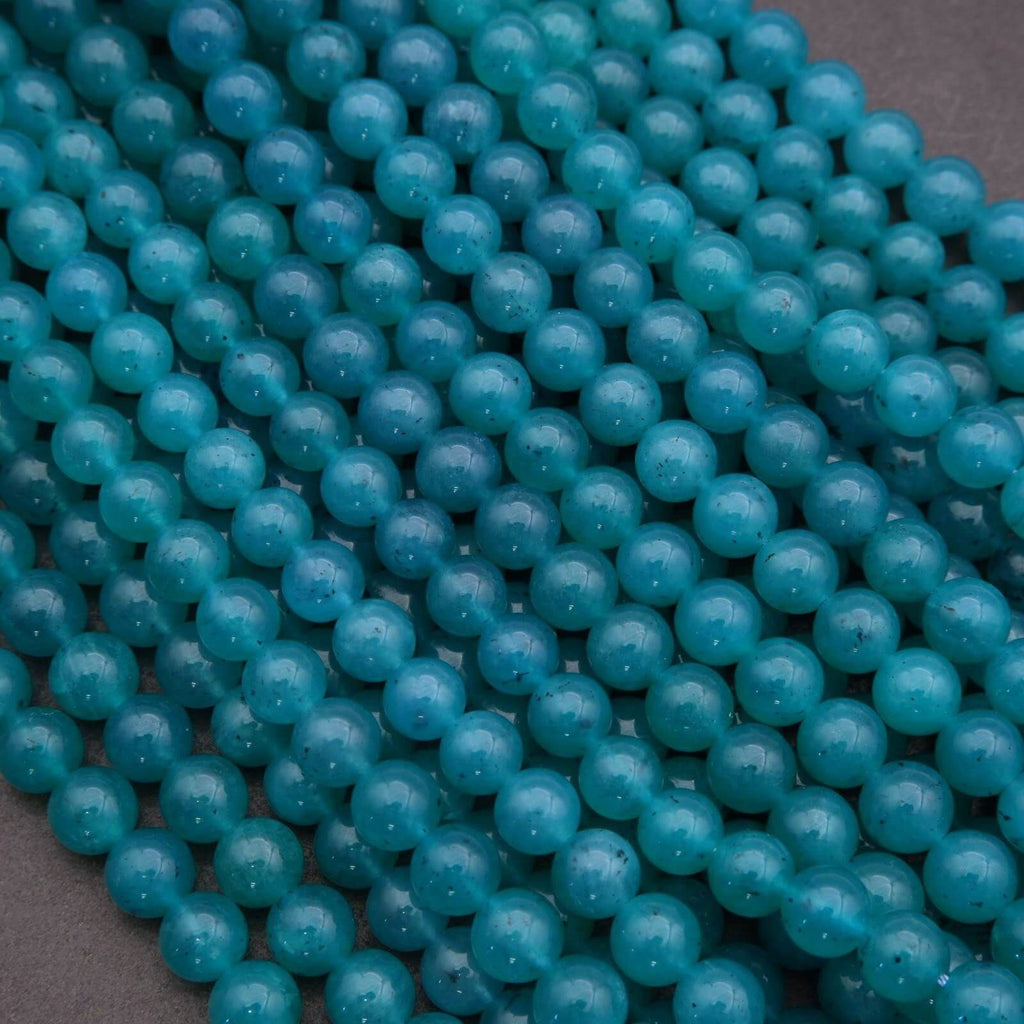 Close-up of turquoise beads on a dark background