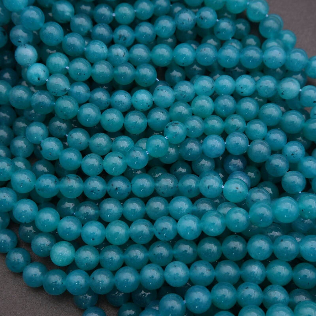 Close-up of turquoise beads on a dark background